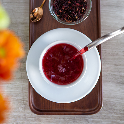 Toddy organic hibiscus tea pouring into cup